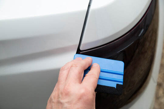 Tinting of the rear headlights of the car.Car design.Detaling center