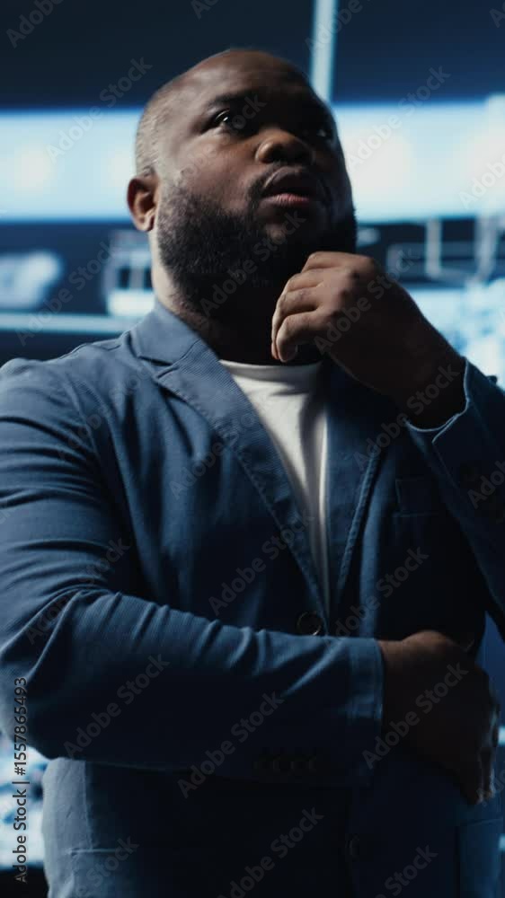 Poster vertical video black male specialist engaged in ai research interacting with data structures or plat