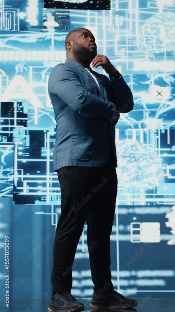 Poster vertical video black male specialist engaged in ai research interacting with data structures or plat