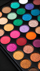 Sparkling eyeshadow swatches on black background