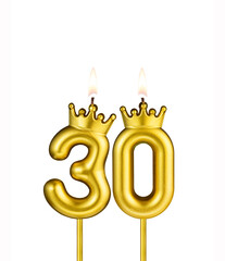Golden number 30 birthday candle on white background