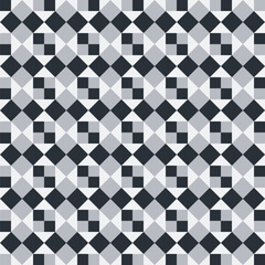 Pattern created from black and grey squares on a pale grey background