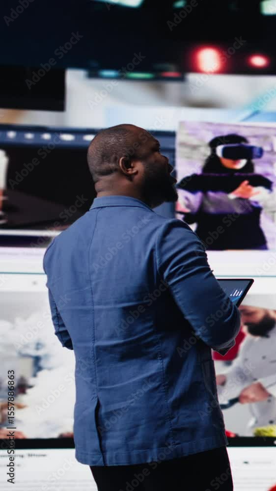 Poster vertical video black social media manager engaging with social network trends on screens, showcasing