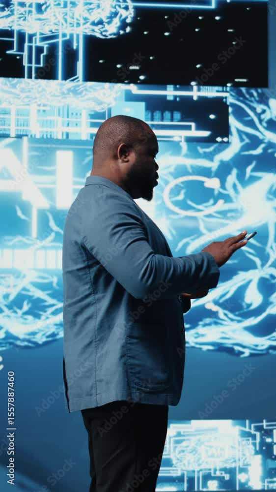 Poster vertical video black male it engineer examining digital ai brain interface on dashboard, symbolizing