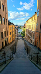 Scenic cobblestone street descending to the waterfront in Stockholm