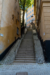 Steep cobblestone steps winding through historic Stockholm alley