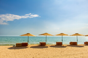 beach with umbrella and chairs