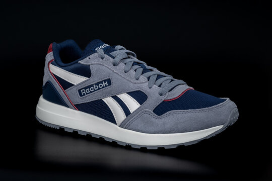 Nis, Serbia - 10 May 2025. Modern reebok classic canvas sneakers on a black background. Reebok GL 1000 unisex lifestyle sneakers. Running shoes. Close up.	