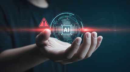 A hand displays an AI chip hologram with a warning triangle, illustrating potential risks and ethical considerations in artificial intelligence development and deployment.