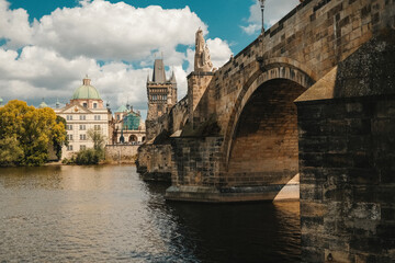 Obraz premium Boat Tour on Vltava river under Charles Bridge, Prague. Praha, old european city