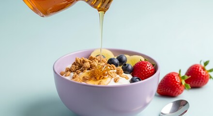 Healthy Yogurt Bowl with Fruit, Granola, and Dripping Honey