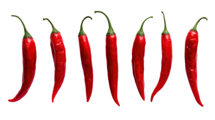  Red chili peppers arranged in a diagonal line, isolated on a white background. © CStock