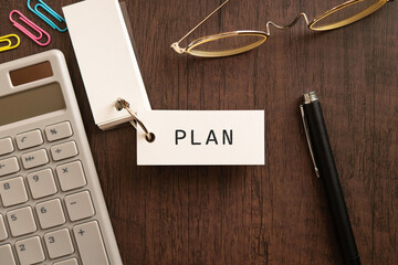 There is word card with the word PLAN. It is as an eye-catching image.