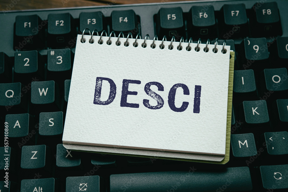 Poster there is notebook with the word desci. it is as an eye-catching image.