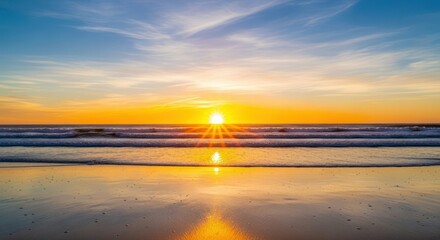 Golden Sunset Reflecting On Wet Beach Shoreline with Vibrant Orange and Yellow Hues Above Ocean Waves under a Blue Sky