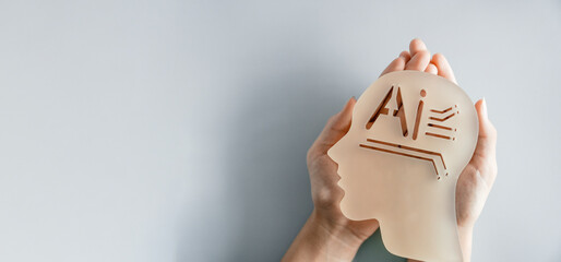 Hand holding AI head, artificial intelligence ethics and legal regulations, artificial super...
