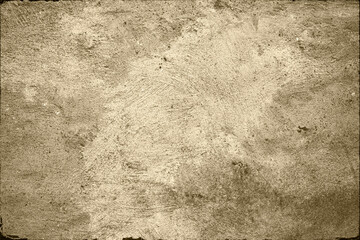 Ancient beige concrete wall with rough edges.