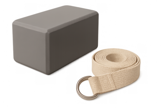 Yoga prop set featuring gray block, beige strap with metal ring, supporting wellness practice against clean background