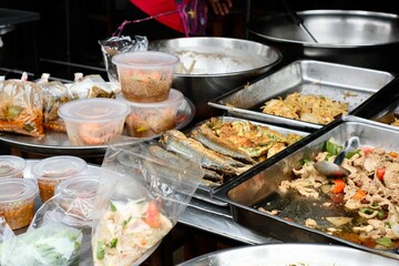 Thai dishes for sale at Soi Prachum, a morning street market in a multicultural area of Bangkok: fried fish, chicken, vermicelli, glass noodles, stir-fried vegetables  - Soi 20, Silom, Bang Rak