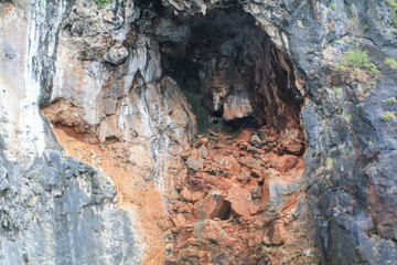 Texture of natural rock on Rough mountains surface. Cracked broken crumbled. Layers of sandstone.
