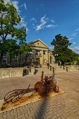 10 Aug 2024 - University of Guelph, ON, Canada. A rusty farm tractor showcasing the agri focus of the university.