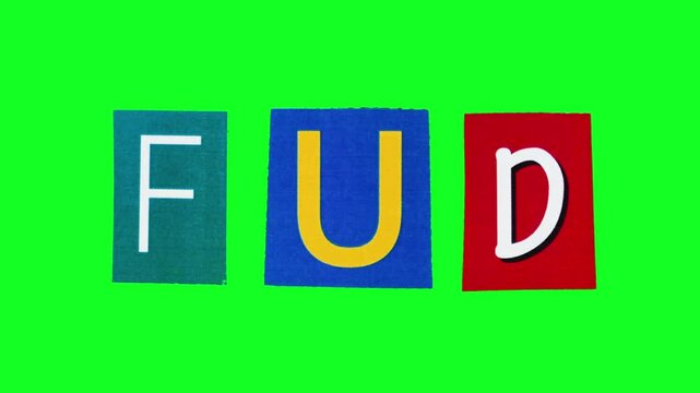 FUD acronym isolated on chroma key background made of magazine cut letters crumpling in loop stop motion. Isolated pattern of the banner about fear uncertainty and doubt concept on crypto market