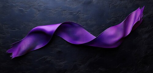 Close-up of a twisted purple ribbon with frayed edges against a dark textured background, highlighting fabric texture and shadows
