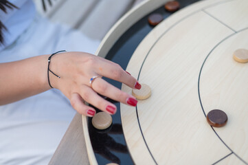 Strategic Game Pieces on a Wooden Board crokinole. 