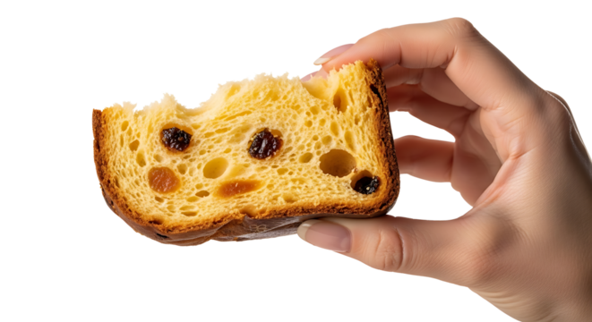 A hand holding a delicious slice of panettone.