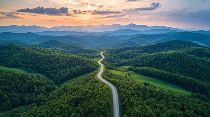 The winding mountain road leads to the distance