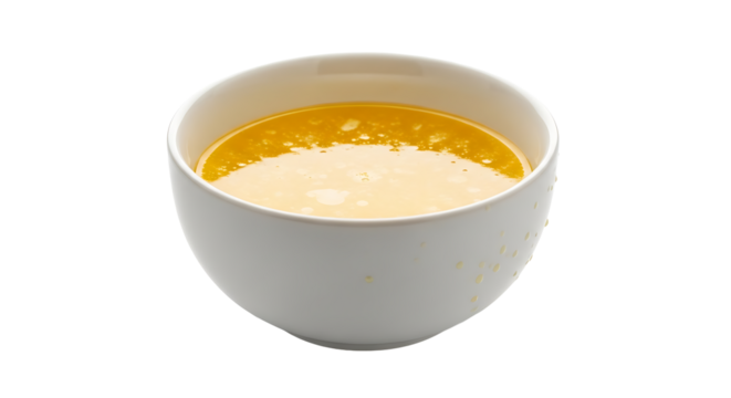Creamy yellow soup in a bowl.
