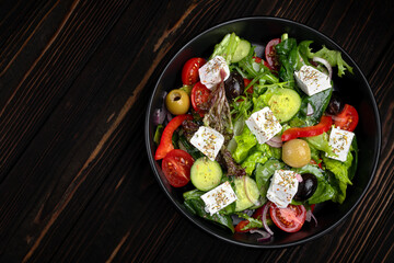 Classic Greek salad on dark background