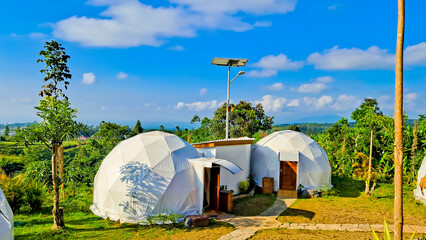 glamping tent view with blue sky background