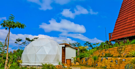glamping tent view with blue sky background