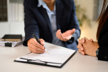 Professional agreement signing between client and business agent in modern office