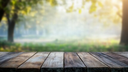 Wooden table overlooking a sunlit, hazy forest