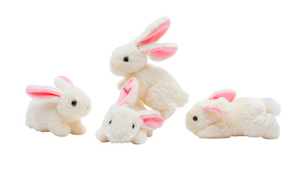 Four fluffy white toy rabbits with pink ears arranged on a black background isolated on a transparent background