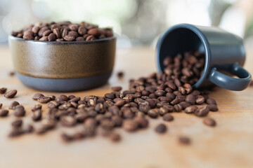 Close up look at roasted coffee beans on wood table