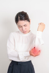 Business Woman having elbow ache for concepts of Tennis Elbow, muscle pain and Sprain, lateral...