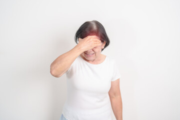 Elderly Woman having headache and Dizzy for concepts of Chronic Stress, Headache and Migraine,...
