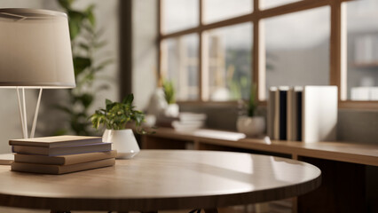 Books and potted plants with lamp aside on round wooden table in a living room or cafe with glass wall.