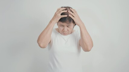 Elderly Woman having headache and Dizzy for concepts of Chronic Stress, Headache and Migraine, World Brain Tumor day, Brain Cancer, Brain Stroke, Dementia, alzheimer, Hypotension and mental health