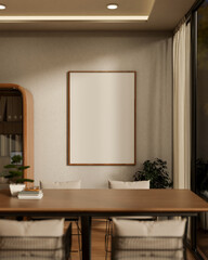 Blank frame on wall aside cabinet and wooden table with bonsai pot and books in living room or cafe.