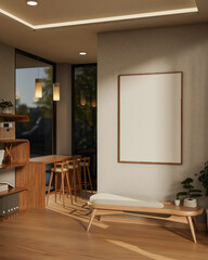 Wooden chair with cushion and bonsai pot under white frame hanging on wall in a cafe or living room.