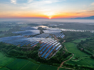 Photovoltaic panels on a hillside at sunrise