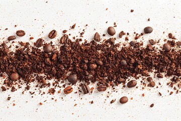 Coffee beans and grounds arranged on a surface, representing the essence of the beverage