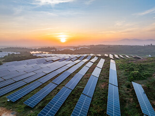 Photovoltaic panels on a hillside at sunrise