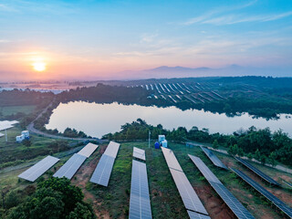 Photovoltaic panels on a hillside at sunrise