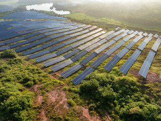 Photovoltaic panels on a hillside at sunrise