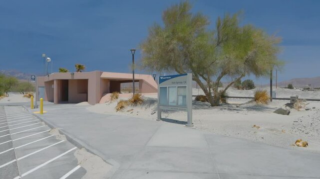 Palm Springs Train Station with piles of drifting sand